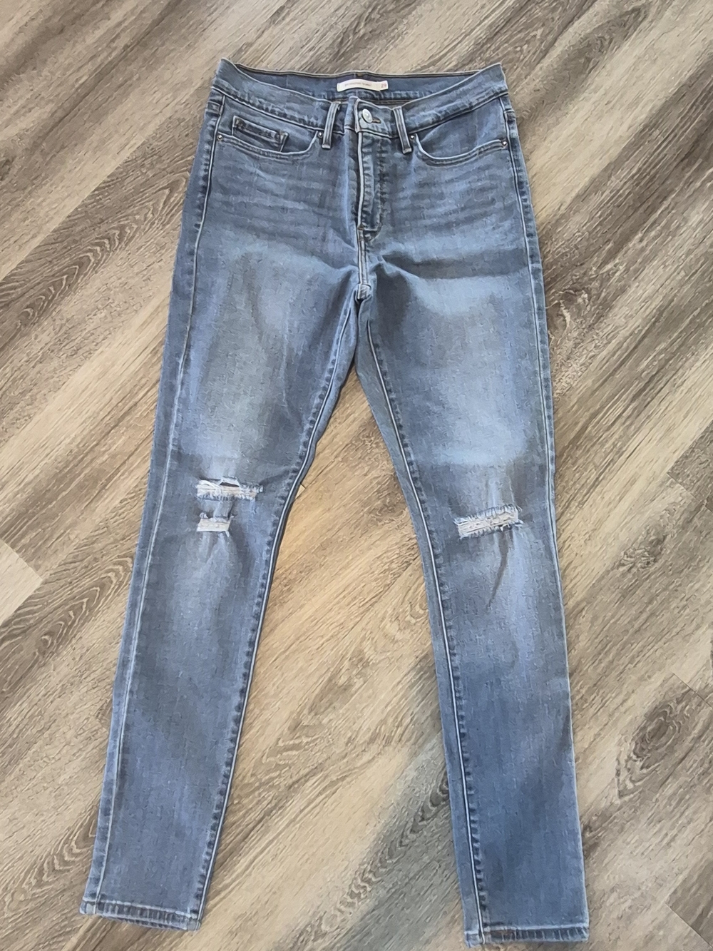 Levis 311 Shaping Light Blue Distressed Skinny Jeans